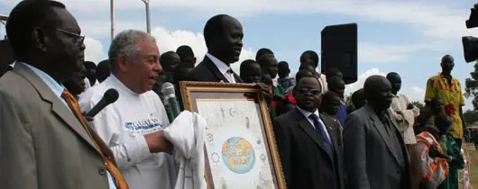 Daniel presenting gifts of peace to the Ministers of the Government of Southern Sudan (GOSS)