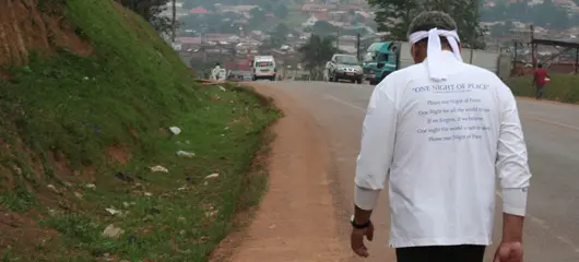 Daniel walking from Kampala to Entebbe